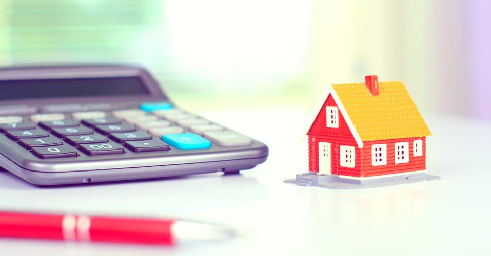 model house next to calculator
