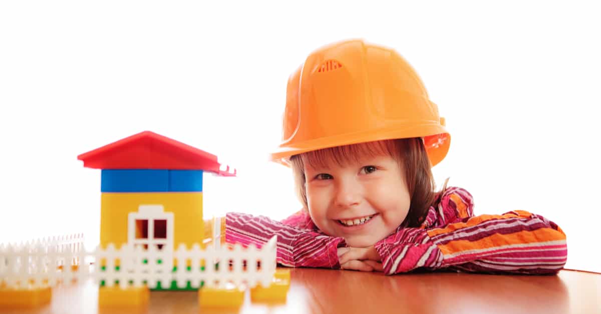 child building lego house