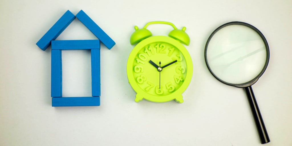 A house a clock and a magnifying glass