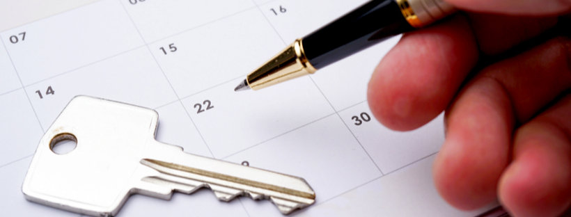 Pen and key on date in calendar
